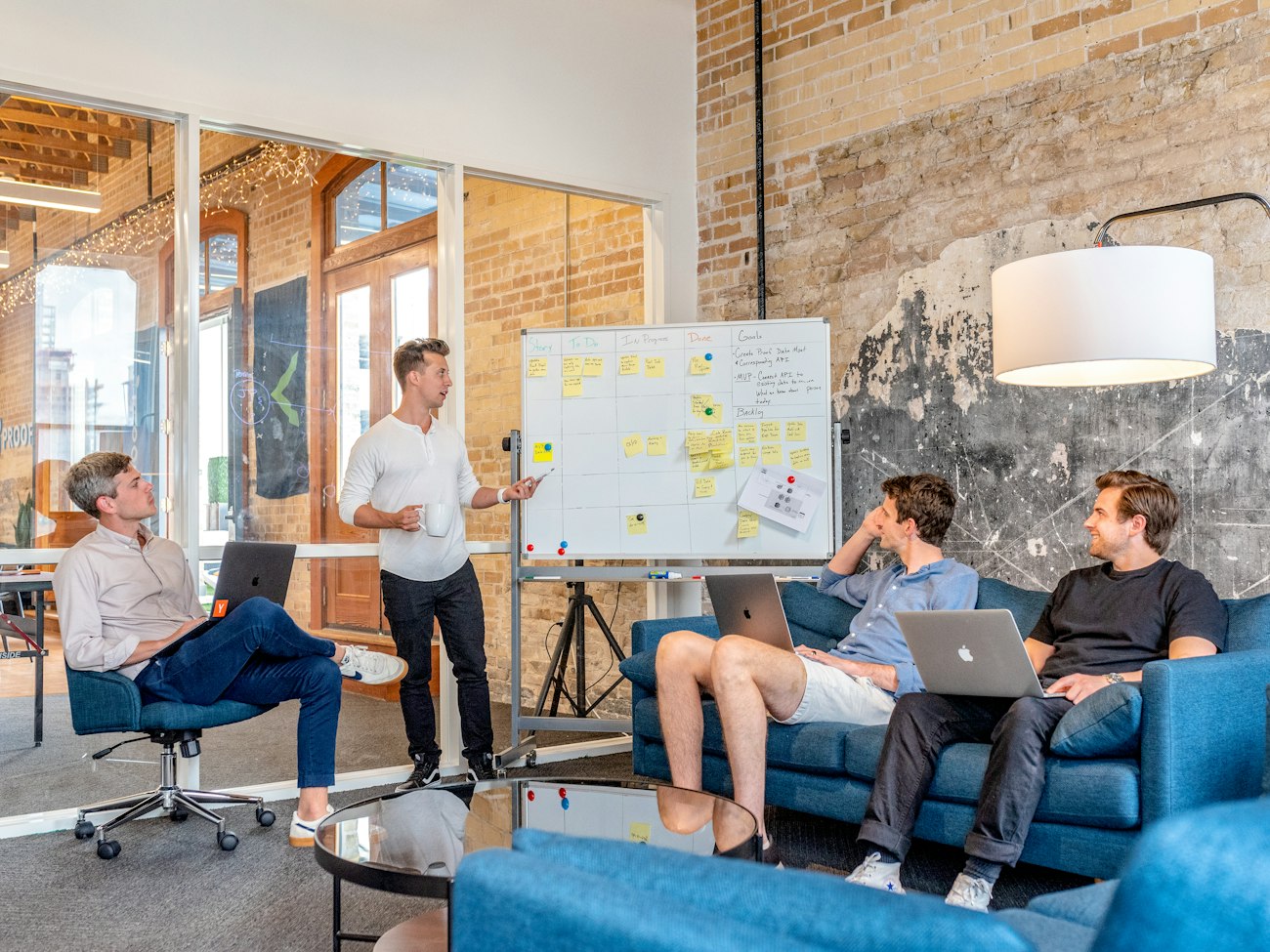 A marketing team planning work together in a modern office