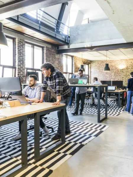 Colleagues working together in a modern open-plan office