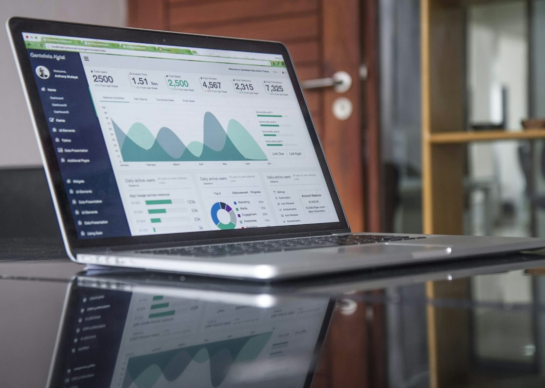 A laptop showing an advertising reporting dashboard